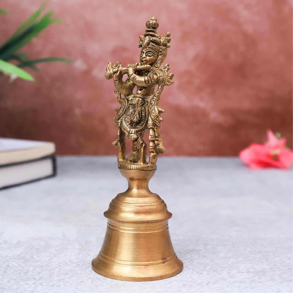 The Advitya Brass Krishan with Flute Standing on Bell