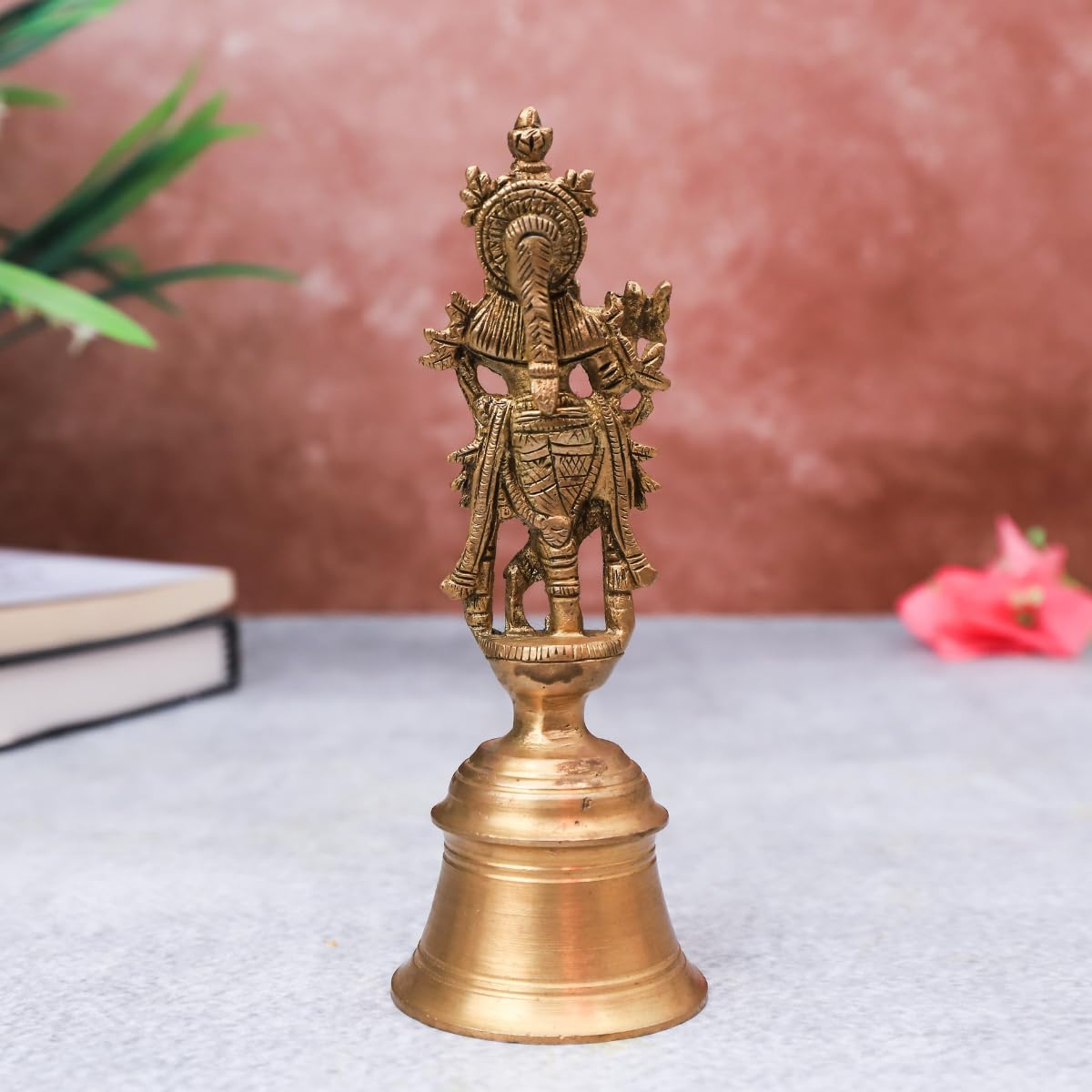 The Advitya Brass Krishan with Flute Standing on Bell
