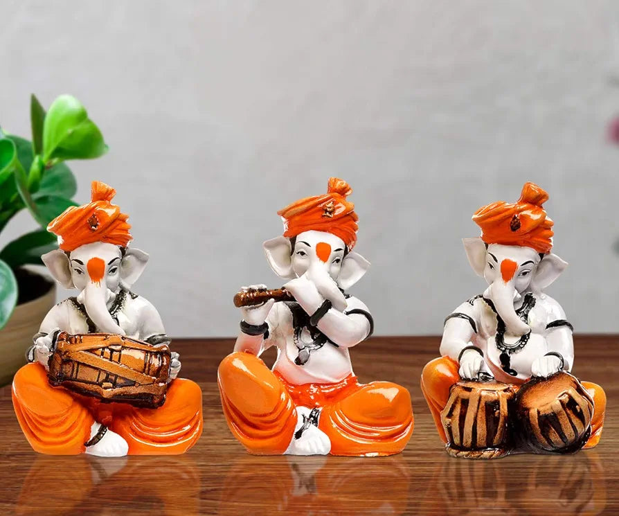 Karigaari India Polyresine Set of 3 Orange Dhoti & Turban Ganesha Playing Instruments Showpiece