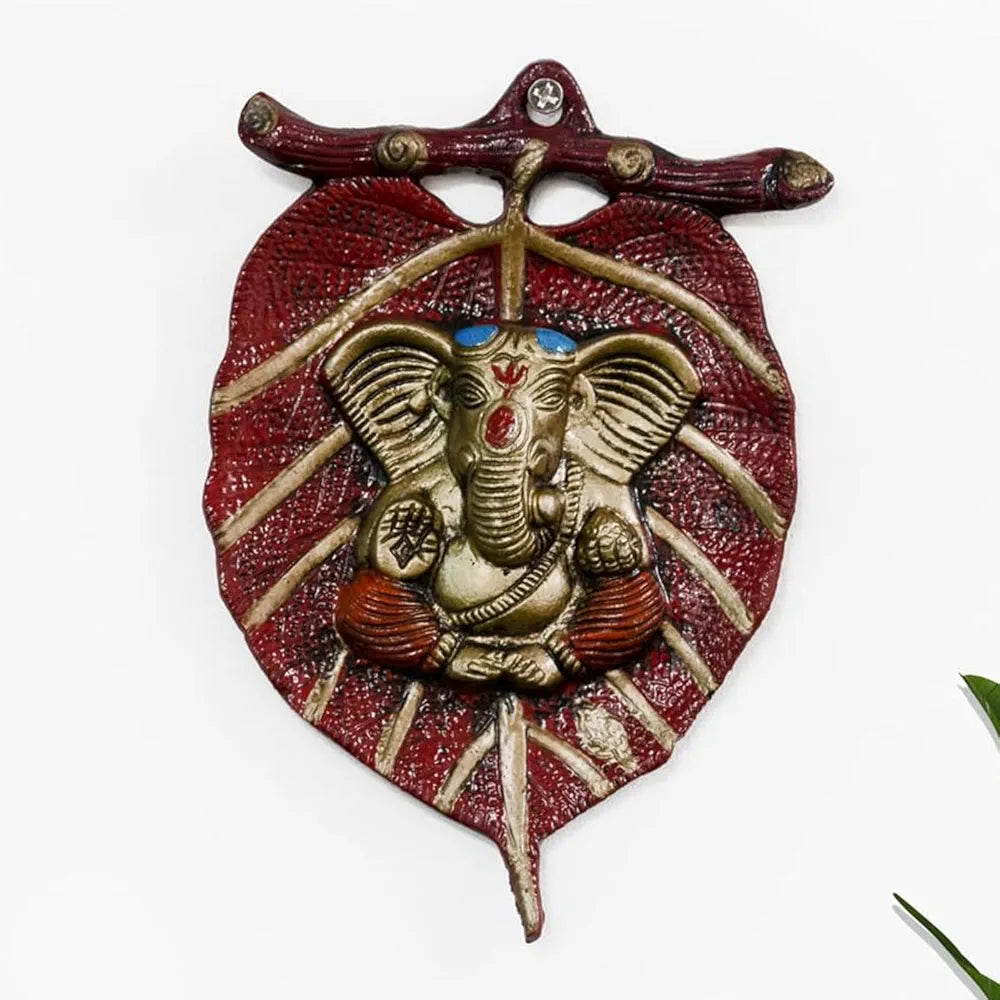 DecorTwist® Metal Lord Ganesha on Red Leaf Wall Hanging Sculpture Decorative Religious Showpiece for Home Wall Decor Pooja Room Temple and House Warming Gift Purpose