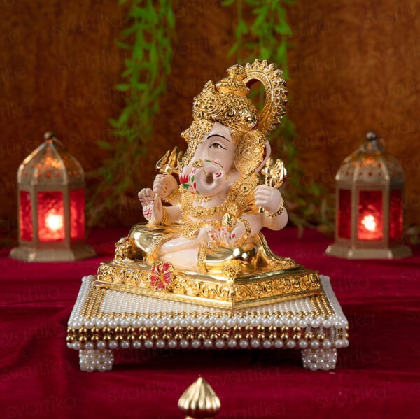 Svastika Dagdusheth ganpati murti with pearl chowki